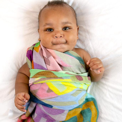 "WRAPPING BABIES IN LOVE" ™  100% organic cotton muslin swaddles are produced using Fair Trade Fabrics, in an ethically principled factory. The inks are Azzo free and there is zero waste.